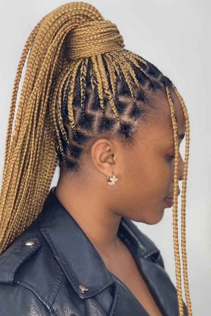 Honey Blonde Knotless Braids in a Sleek High Wrap