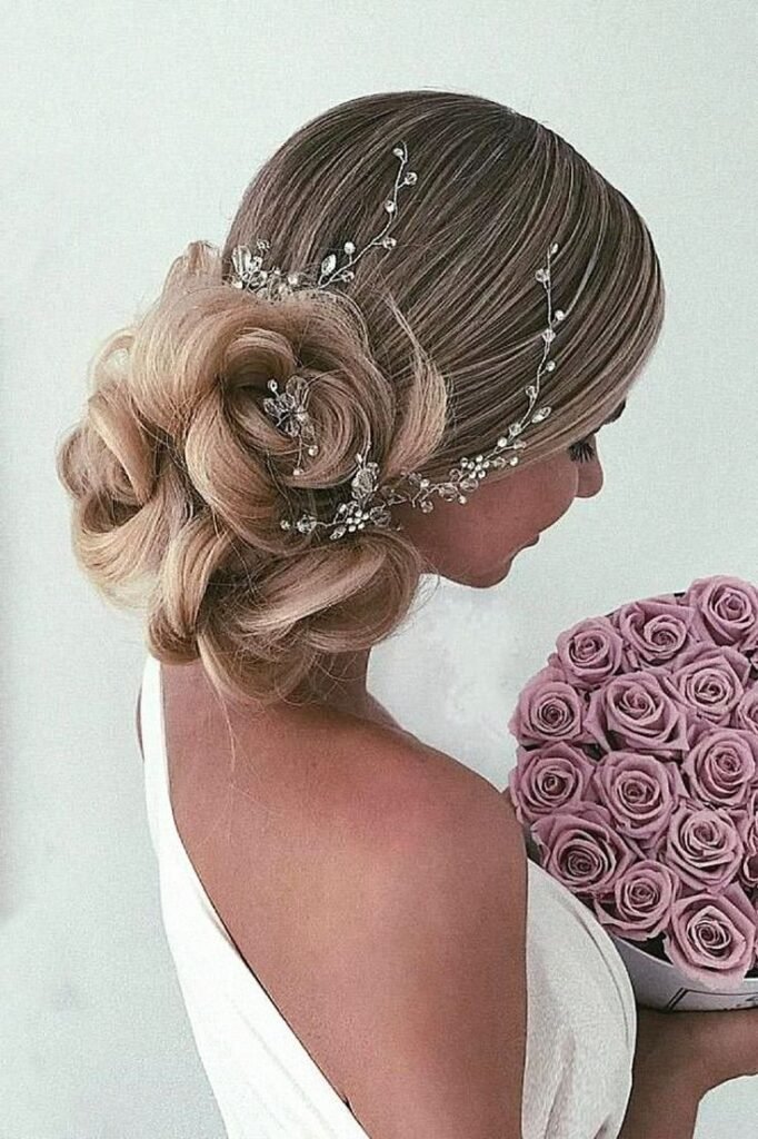 Intricate Rose-Shaped Low Bun with Crystal Vine Accessory