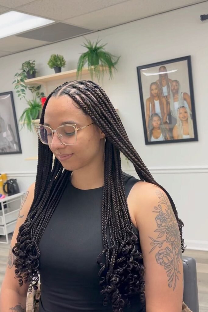 Knotless Braids with Curly Voluminous Ends and Center Part