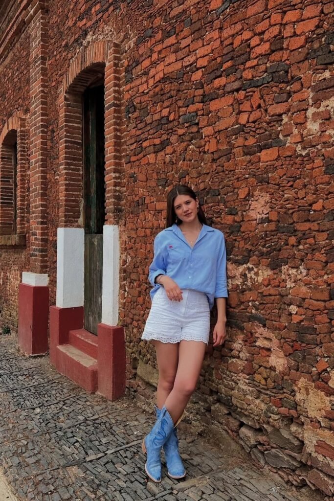 Light Blue Button-Down Shirt + White Eyelet Shorts + Bright Blue Cowboy Boots