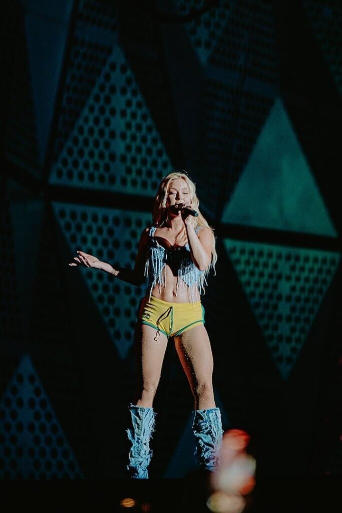 Light Blue Fringed Denim Top + Yellow and Green Micro Shorts + Distressed Denim Boot Covers