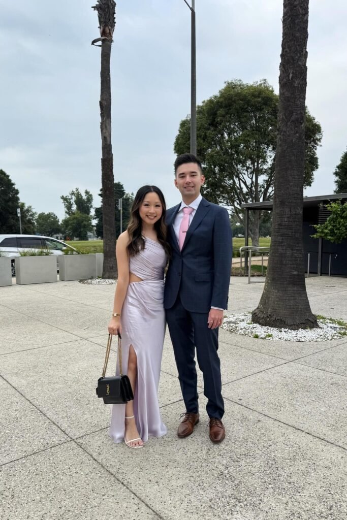 Lilac One-Shoulder Satin Gown + White Strappy Sandals + Black Chain Bag