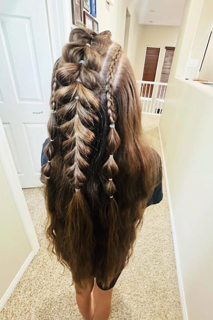 Long Brunette Pull-Through Braid with Multiple Accent Micro-Braids