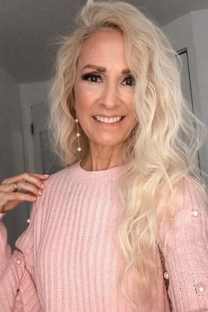 Long Platinum Blonde Waves with Side-Swept Volume