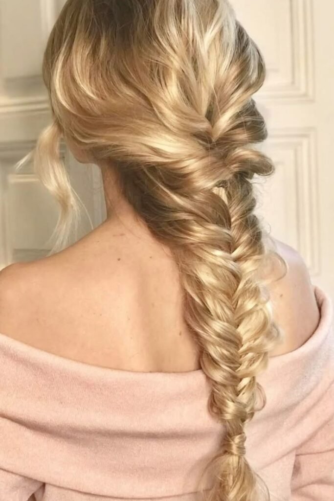 Loose Tousled Side Braid with Face-Framing Tendrils