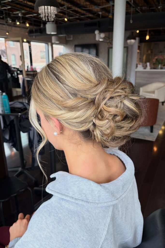 Low Textured Chignon with Honey Blonde Highlights