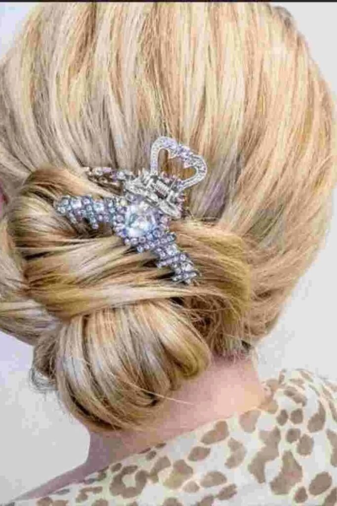 Low Twisted Bun with Intricate Rhinestone Butterfly Clip