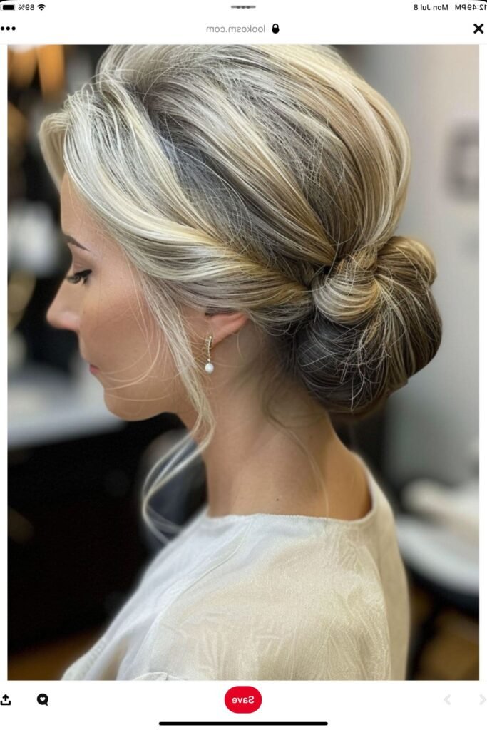 Modern Twisted Low Bun with Face-Framing Waves