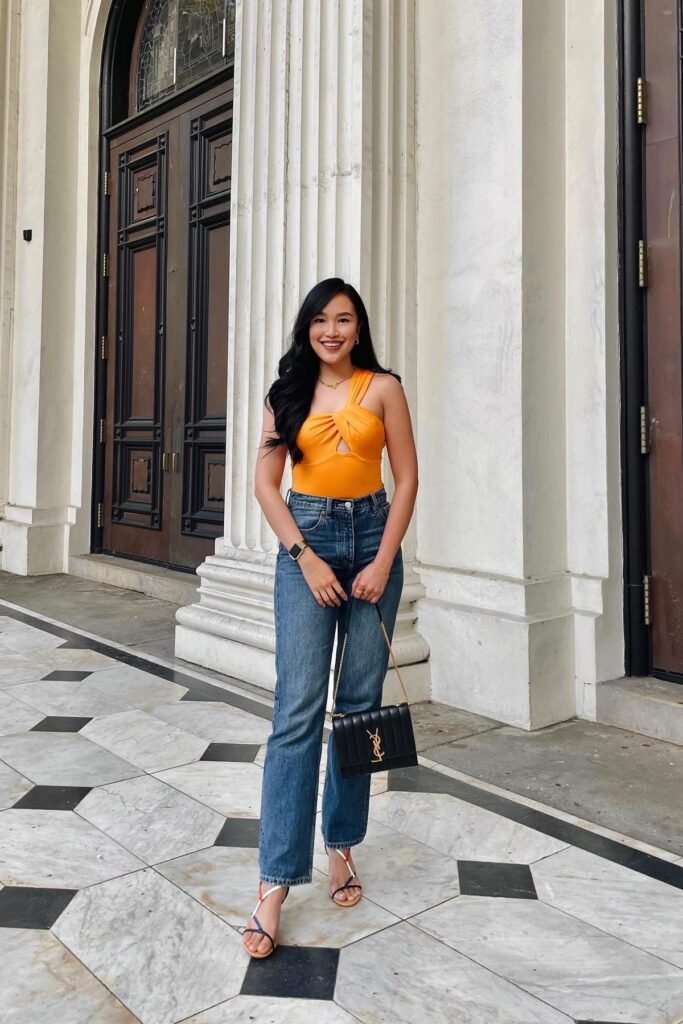 Orange Cut-Out Bodysuit + Dark-Wash Straight Jeans + Multi-Color Strappy Sandals