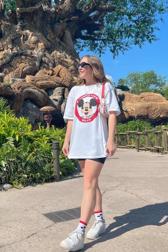 Oversized Mickey Mouse Club Graphic T-Shirt + Black Biker Shorts + Mickey Mouse Crew Socks + White Sneakers