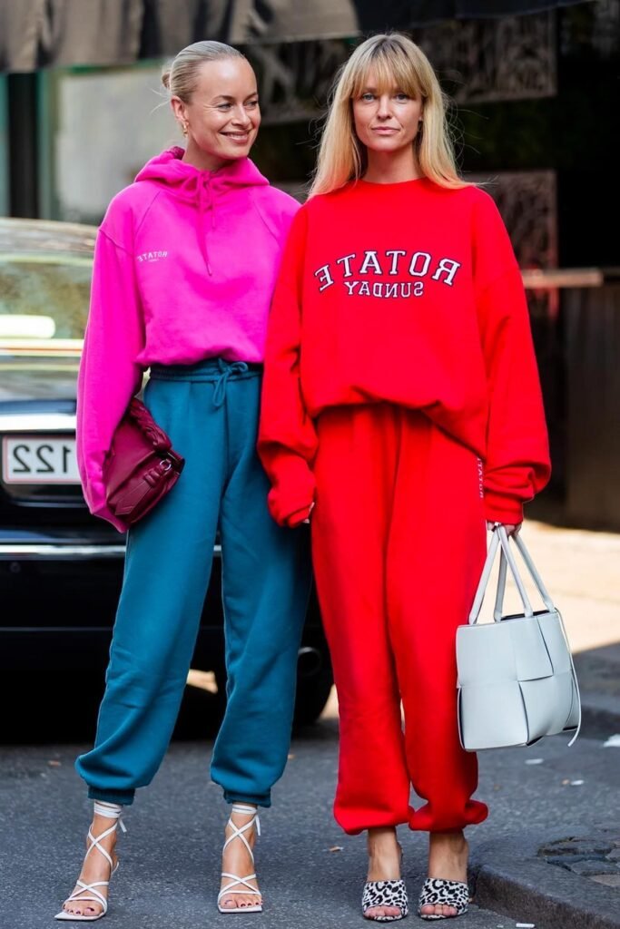 Oversized Pink Hoodie + Teal Joggers + White Lace-Up Heeled Sandals / Oversized Red Graphic Sweatshirt + Red Sweatpants + Leopard Print Mules
