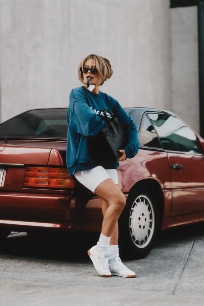 Oversized Teal Sweatshirt + White Biker Shorts + White Sneakers with High Socks