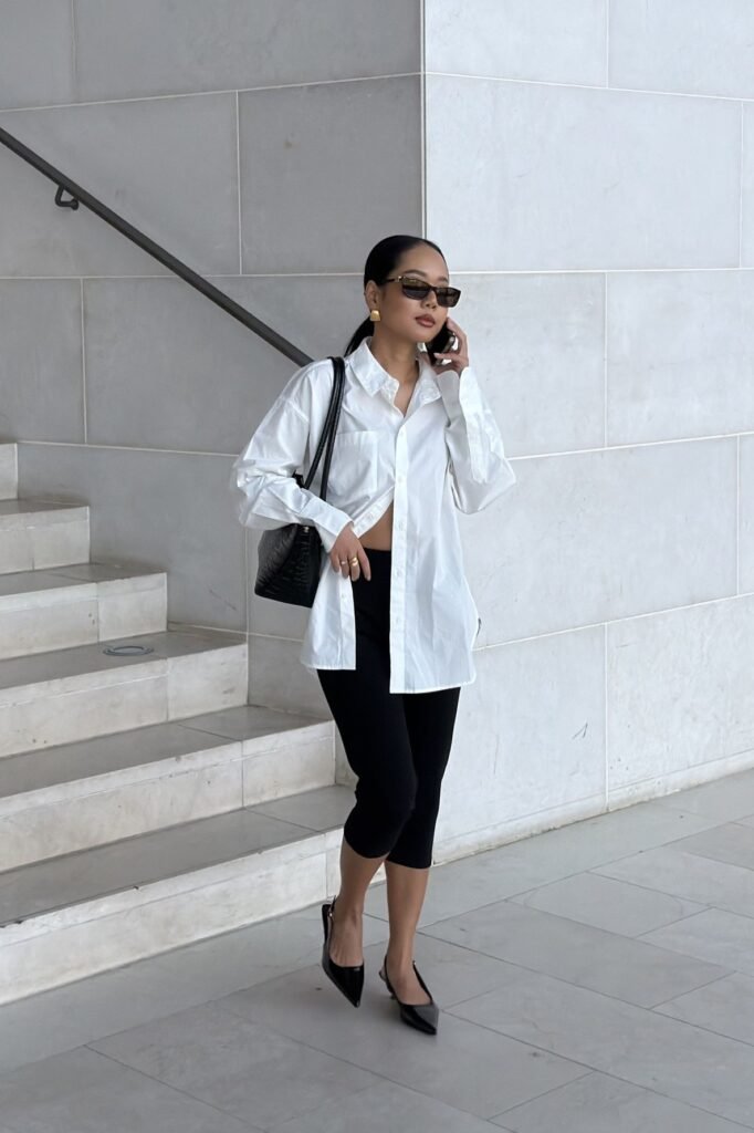 Oversized White Button-Down Shirt + Black Capri Leggings + Black Pointed-Toe Slingback Heels