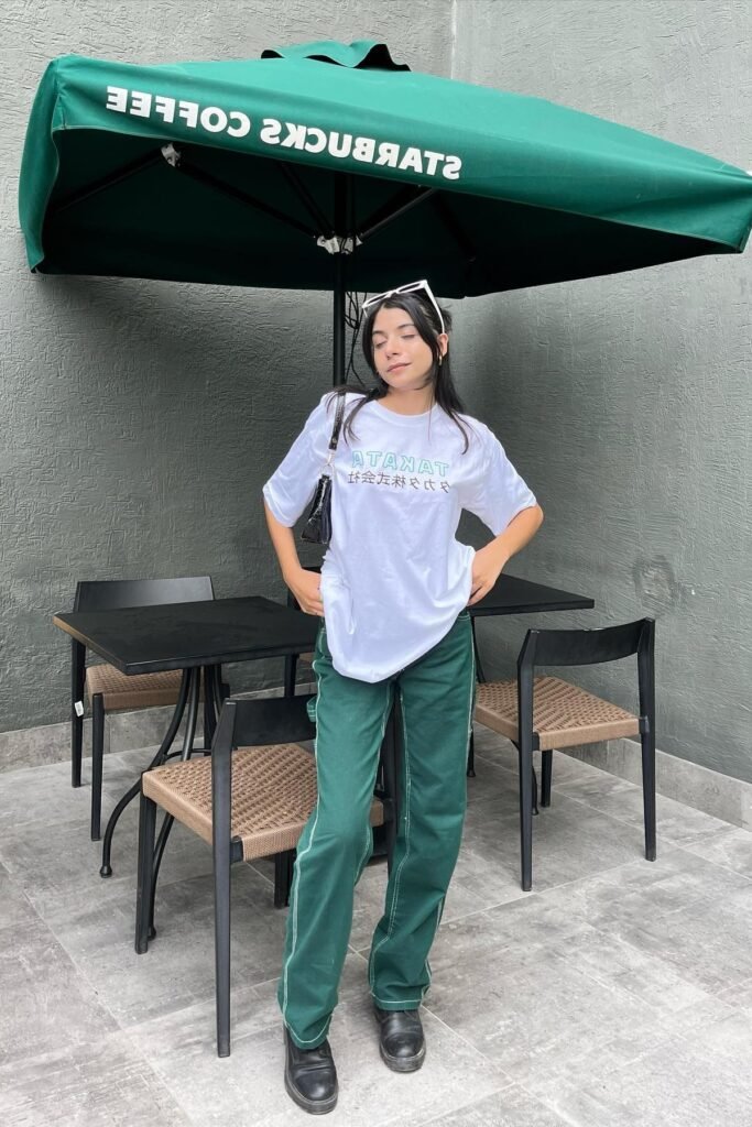 Oversized White Graphic T-Shirt + Dark Green Contrast Stitch Trousers + Black Boots