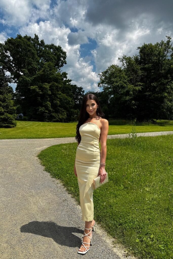Pale Yellow Strapless Column Dress + White Strappy Heeled Sandals + Gold Glitter Clutch