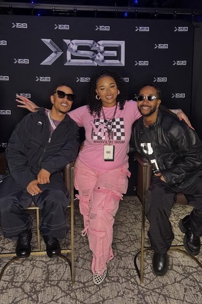 Pink MTV Graphic T-Shirt + Pink Multi-Pocket Cargo Pants + Black and White Checkered Vans