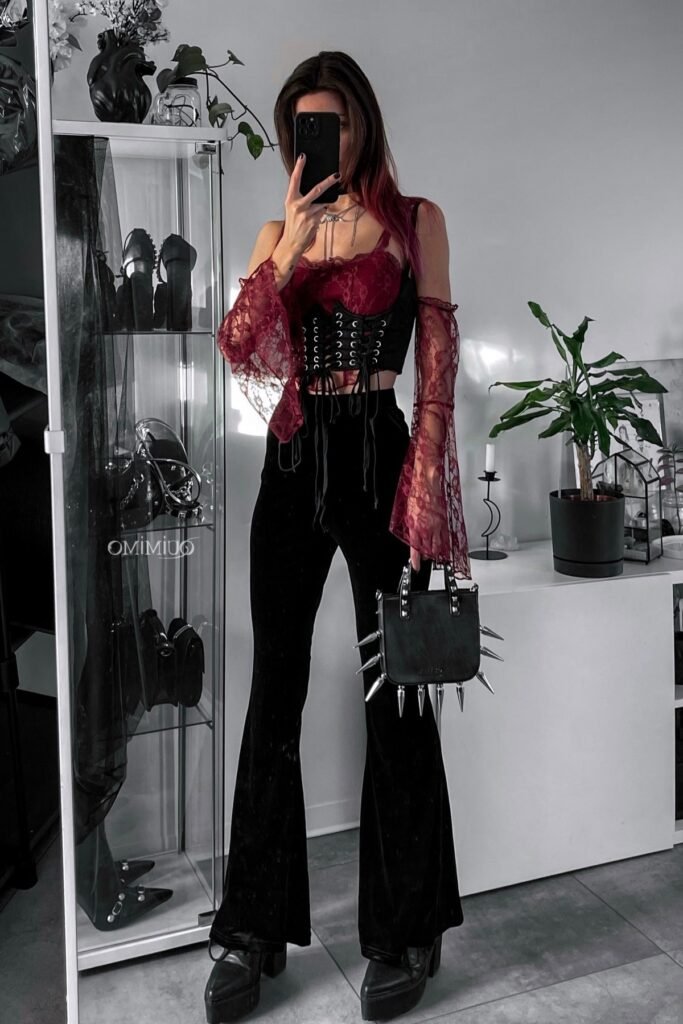 Red Lace Bustier with Flared Sleeves + Black Lace-Up Corset Belt + Black Velvet Flared Trousers + Spiked Handbag