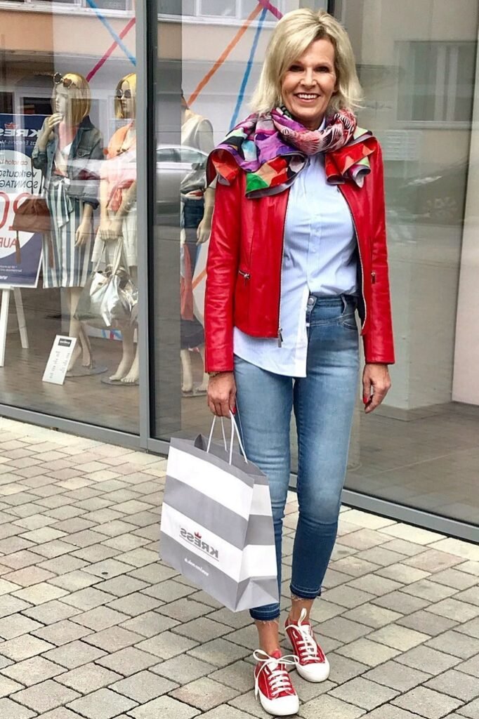 Red Leather Biker Jacket + Light Blue Striped Shirt + Skinny Jeans + Red Low-Top Sneakers