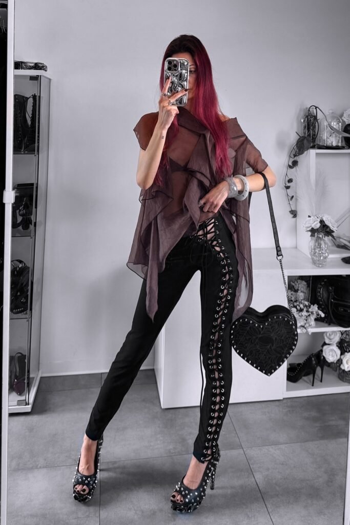 Sheer Ruffled Brown Blouse + Black Lace-Up Side Skinny Pants + Studded Open-Toe Platform Heels + Heart-Shaped Spiderweb Bag