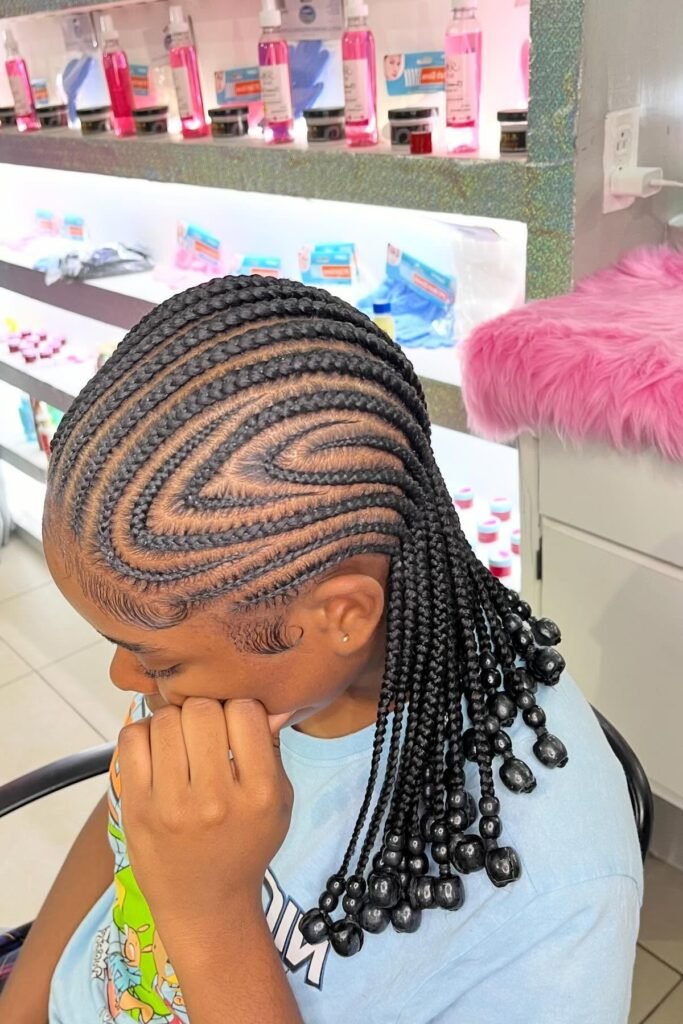 Short Layered Braids with Large Black Beads and Zig-Zag Parting