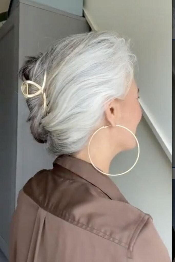 Silver Twisted Low Bun with Gold Geometric Open-Loop Clip
