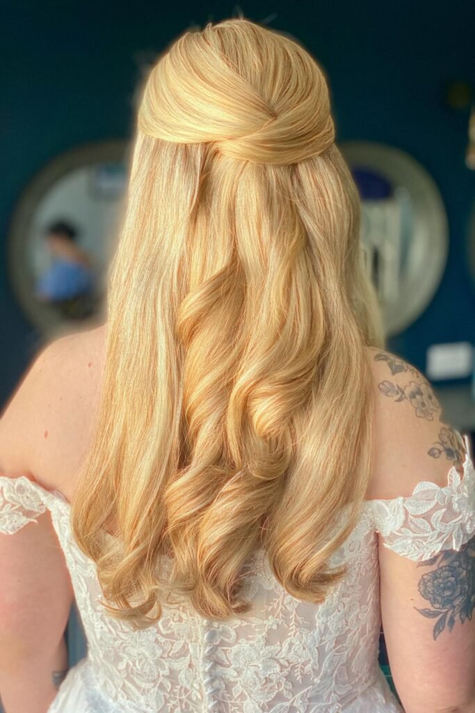 Sleek Half-Up Twisted Crown with Long Golden-Blonde Waves