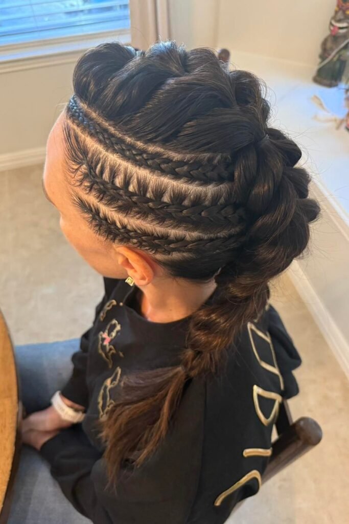 Sleek Raven Side Cornrows with Voluminous Center Dutch Braid