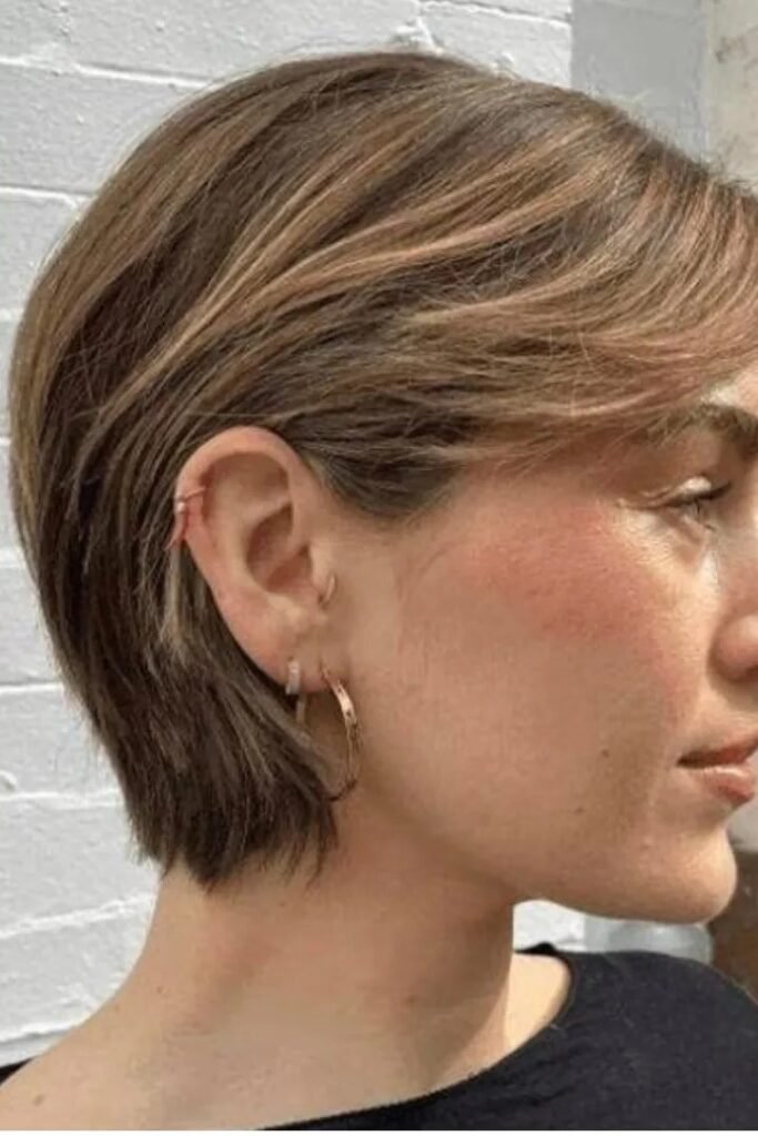 Sleek Tucked-Behind-Ear Bob with Side-Swept Fringe