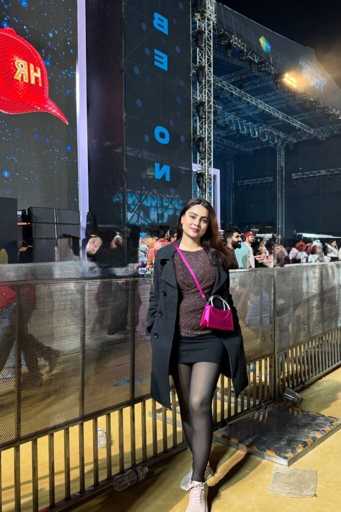 Sparkly Brown Long-Sleeve Top + Black Mini Skirt + Black Overcoat + Pink Crossbody Bag