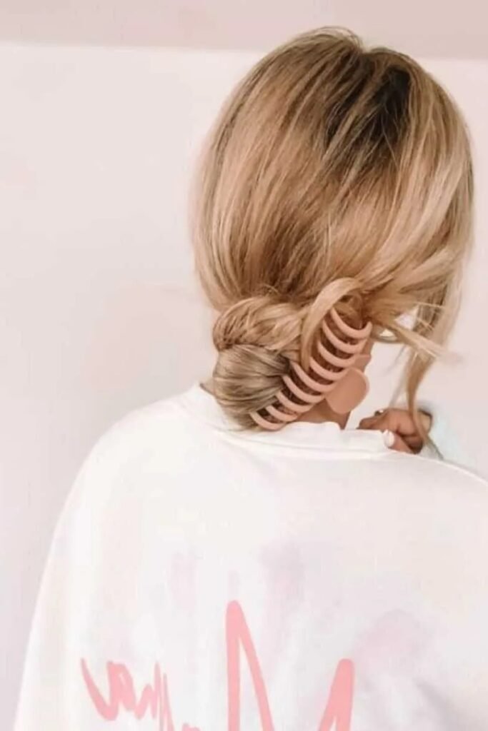 Tucked Low Bun Secured with Matte Peach Open-Claw Clip