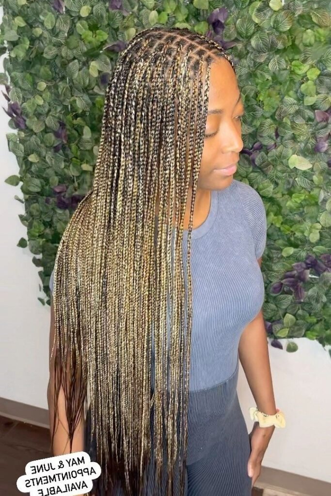 Ultra-Fine Micro Braids with Ombre Color Blend and Floral Backdrop
