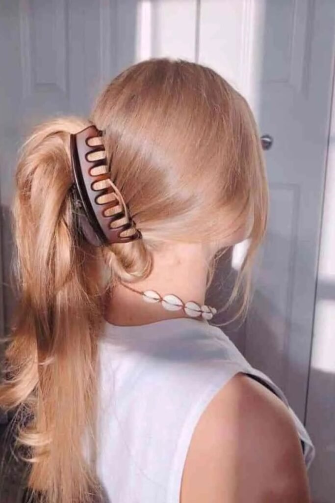 Voluminous High Ponytail with Large Arch Claw Clip