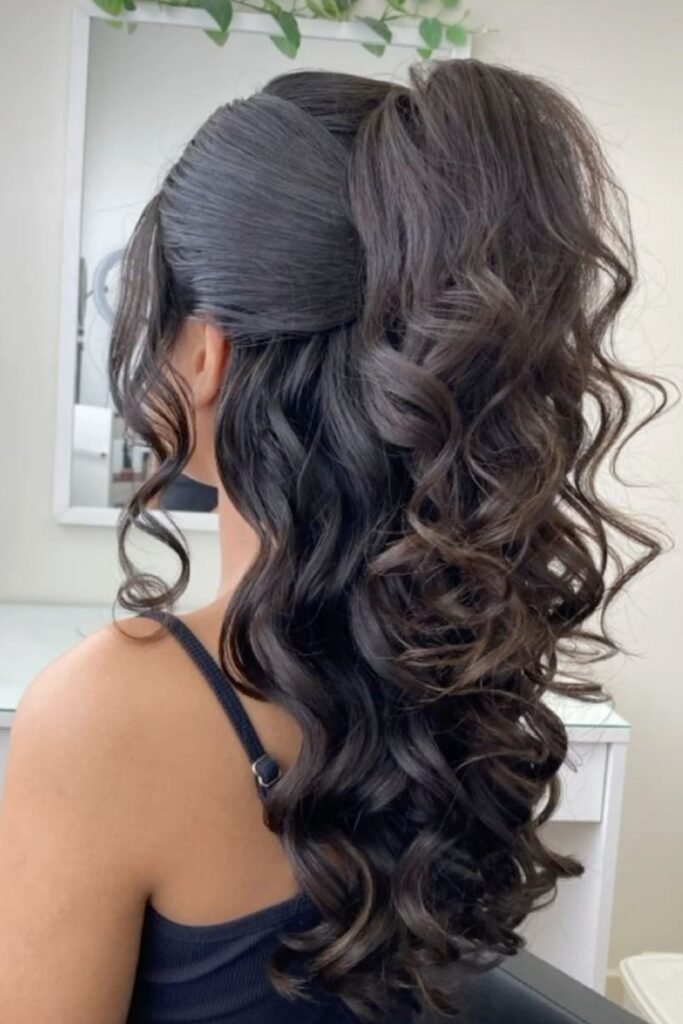 Voluminous High Ponytail with Long Cascading Curls