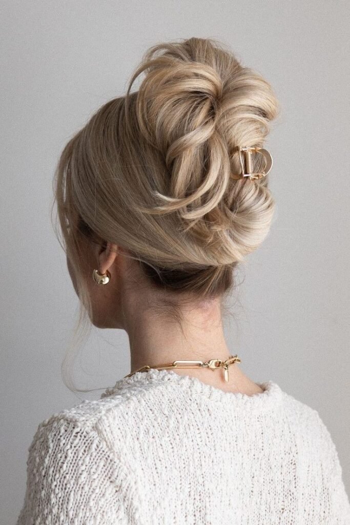 Voluminous Layered Updo with Gold Circular Metal Clip
