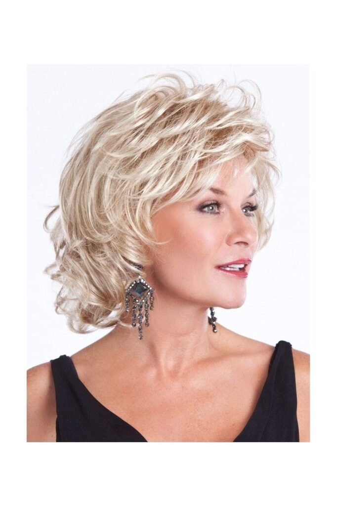 Voluminous Shaggy Blonde Layers with Wispy Fringe