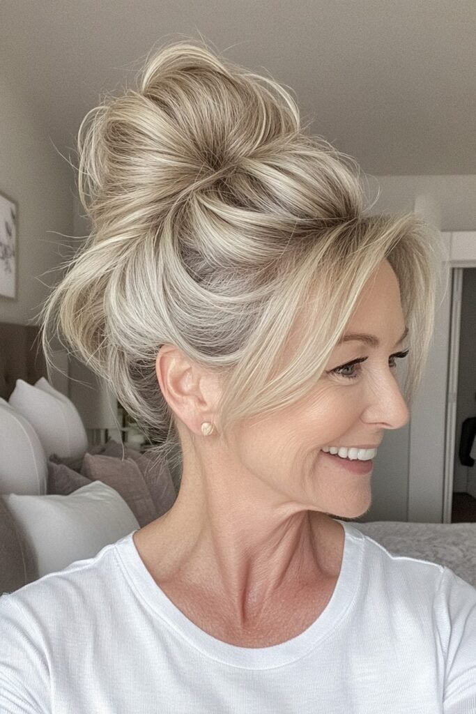 Voluminous Tousled Top Knot with Long Curtain Bangs