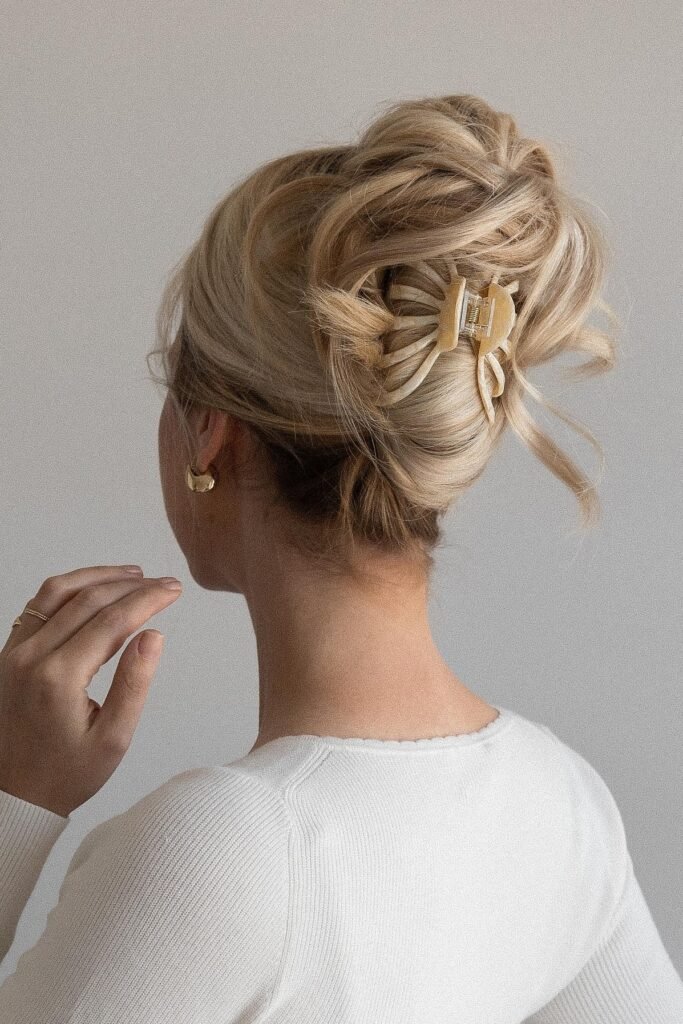 Voluminous Tousled Updo with Cream Petal Clip