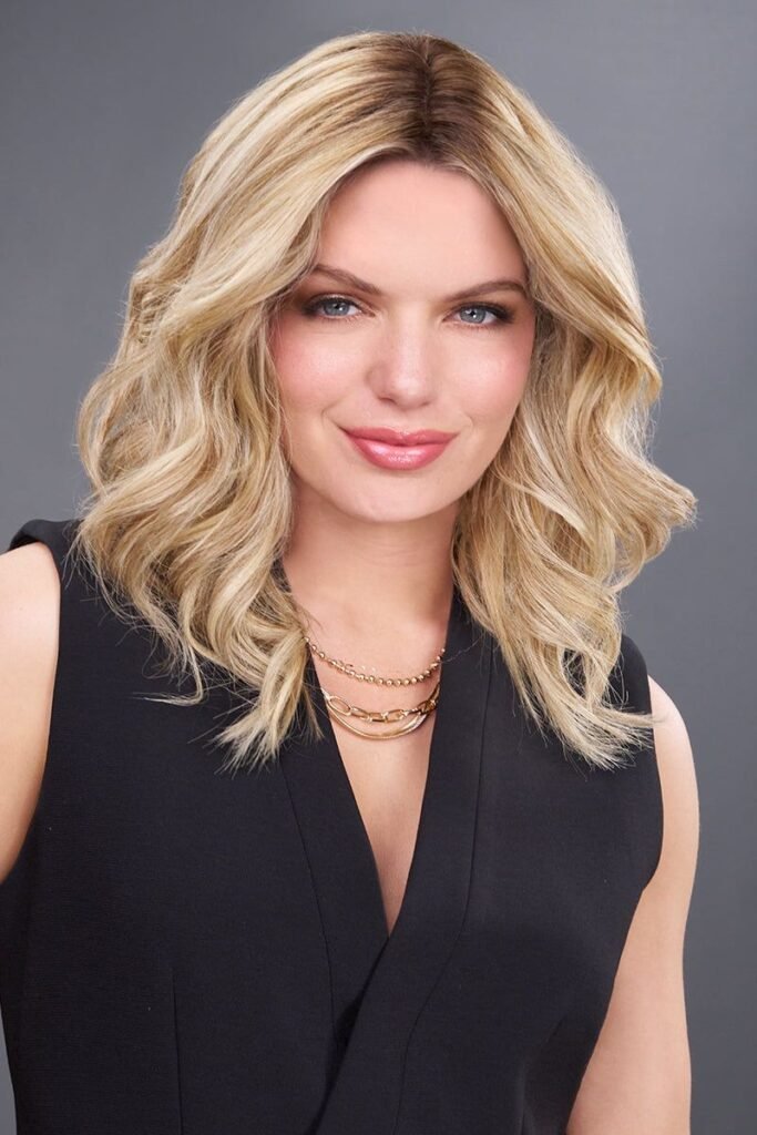 Wavy Blonde Mid-Length Cut with Center Part