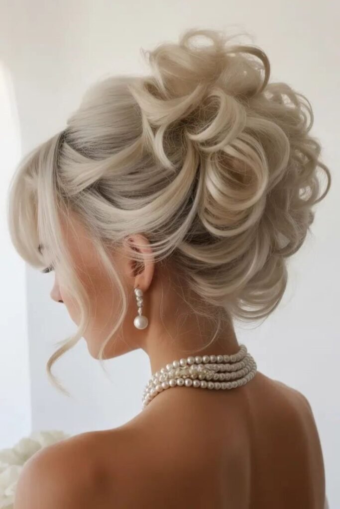 Whimsical Curly Updo with Loose Waves and Pearl Accents