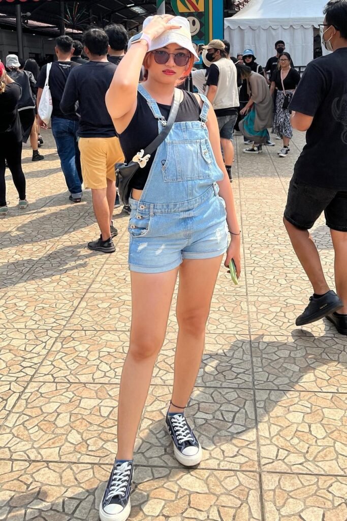 White Bucket Hat + Light Wash Denim Overalls + Black Tank Top + Black and White High-Top Sneakers