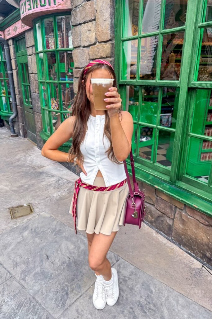 White Button-Up Sleeveless Top + Beige Mini Skirt + White Sneakers