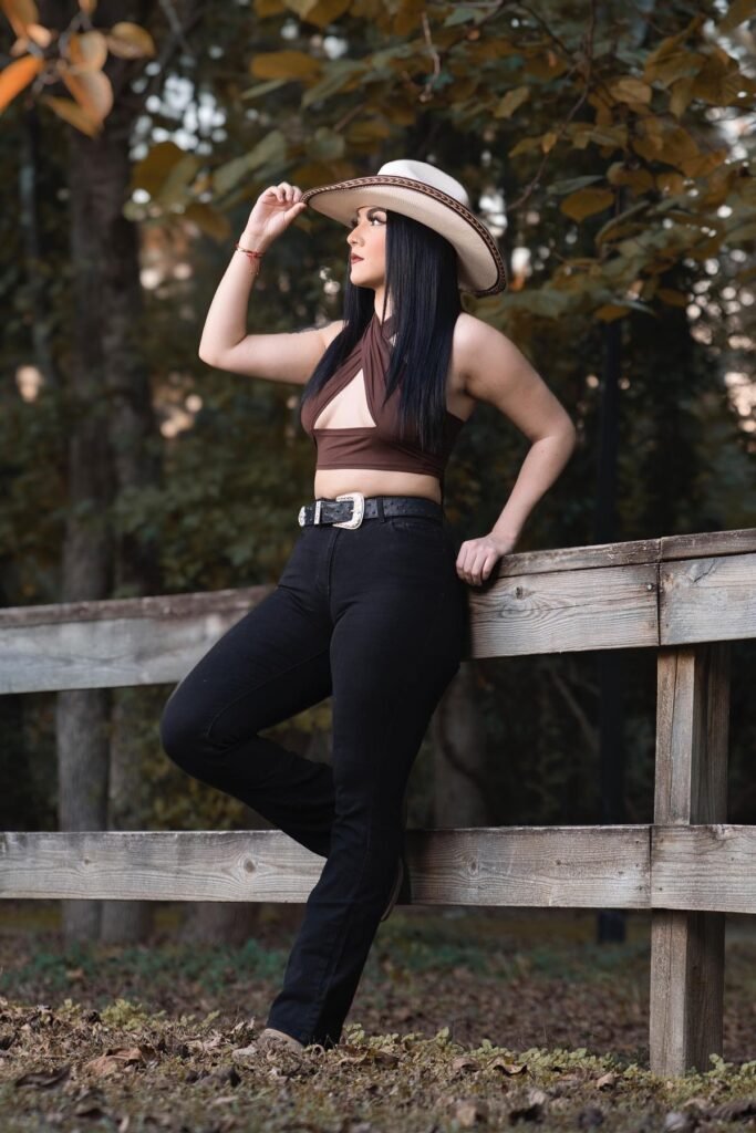 White Cowboy Hat with Brown Trim + Brown Halter Wrap Crop Top + Black High-Waisted Flare Jeans