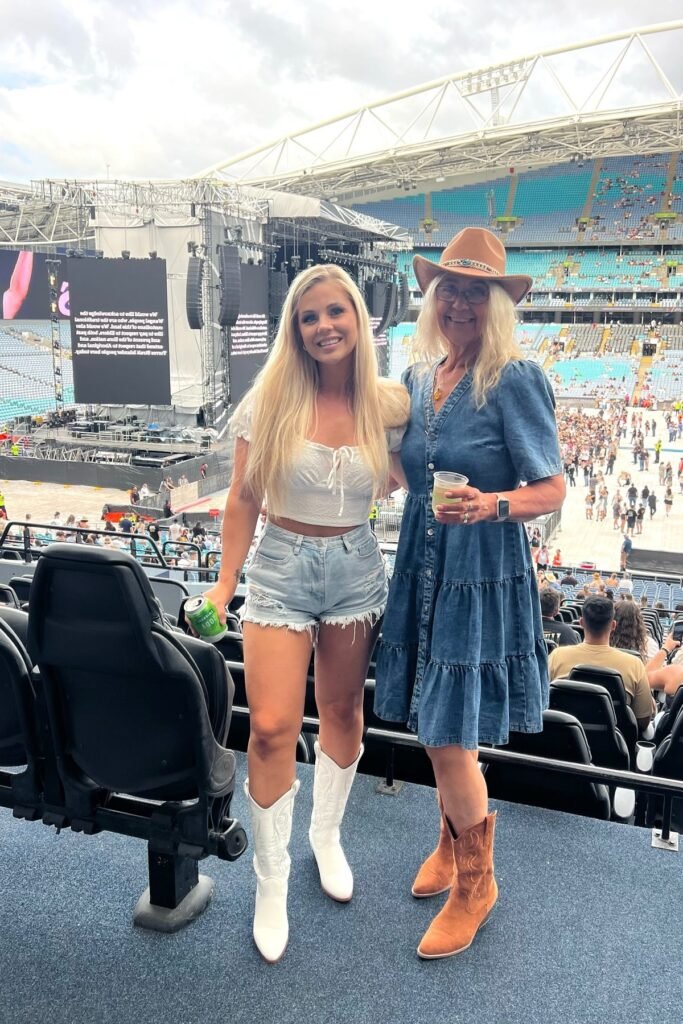 White Crop Top + Distressed Denim Shorts + White Cowboy Boots