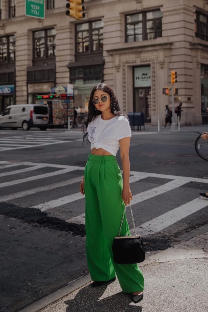 White Graphic Crop Tee + Bright Green Pleated Wide-Leg Pants + Black Pointed-Toe Flats
