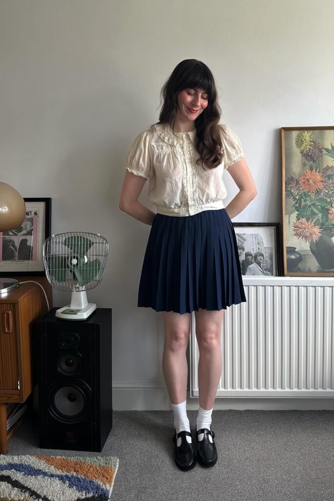 White Lace Short-Sleeve Blouse + Navy Pleated Skirt + Black Mary Janes