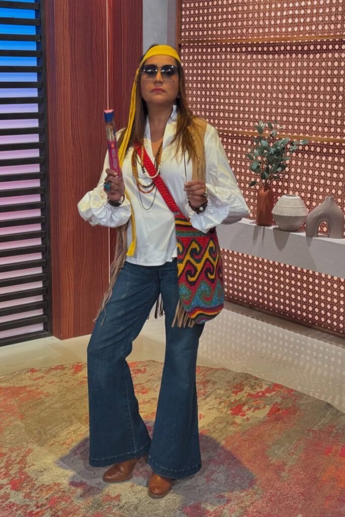 White Puff-Sleeve Blouse + Blue Flare Jeans + Brown Leather Boots + Yellow Headband + Multi-Colored Woven Bag