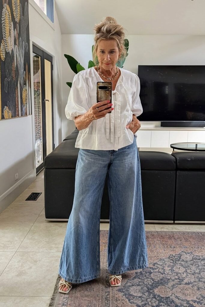 White Puff-Sleeve Blouse + Wide-Leg Denim Trousers + White Strappy Heels