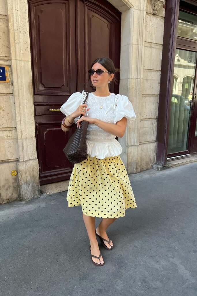 White Puff-Sleeve Smocked Top + Yellow Polka Dot Midi Skirt + Brown Flip Flops