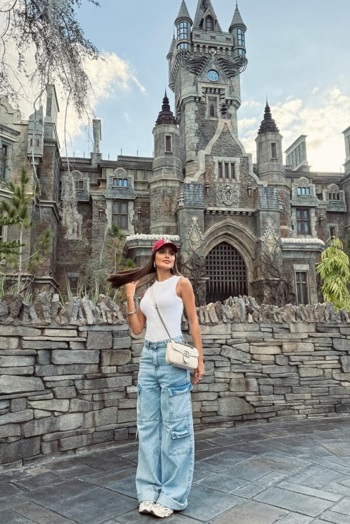 White Ribbed Tank Top + Light Wash Cargo Jeans + Cream Sneakers