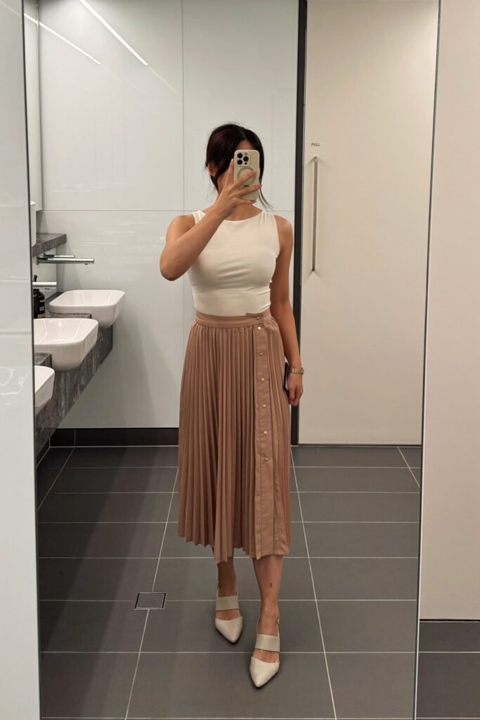 White Sleeveless Bodysuit + Mauve Pleated Button-Front Midi Skirt + Cream Pointed-Toe Slingback Heels